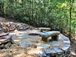 Beautiful large stone fire pit with creek views at Amy`s Creek 2